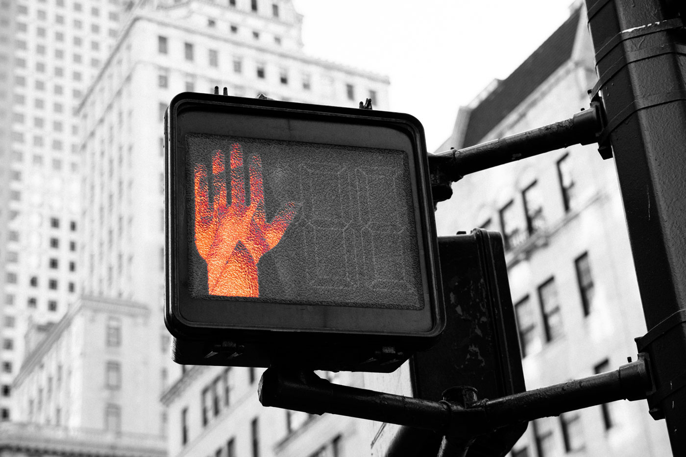 The sign of the red hand is on every street corner.
